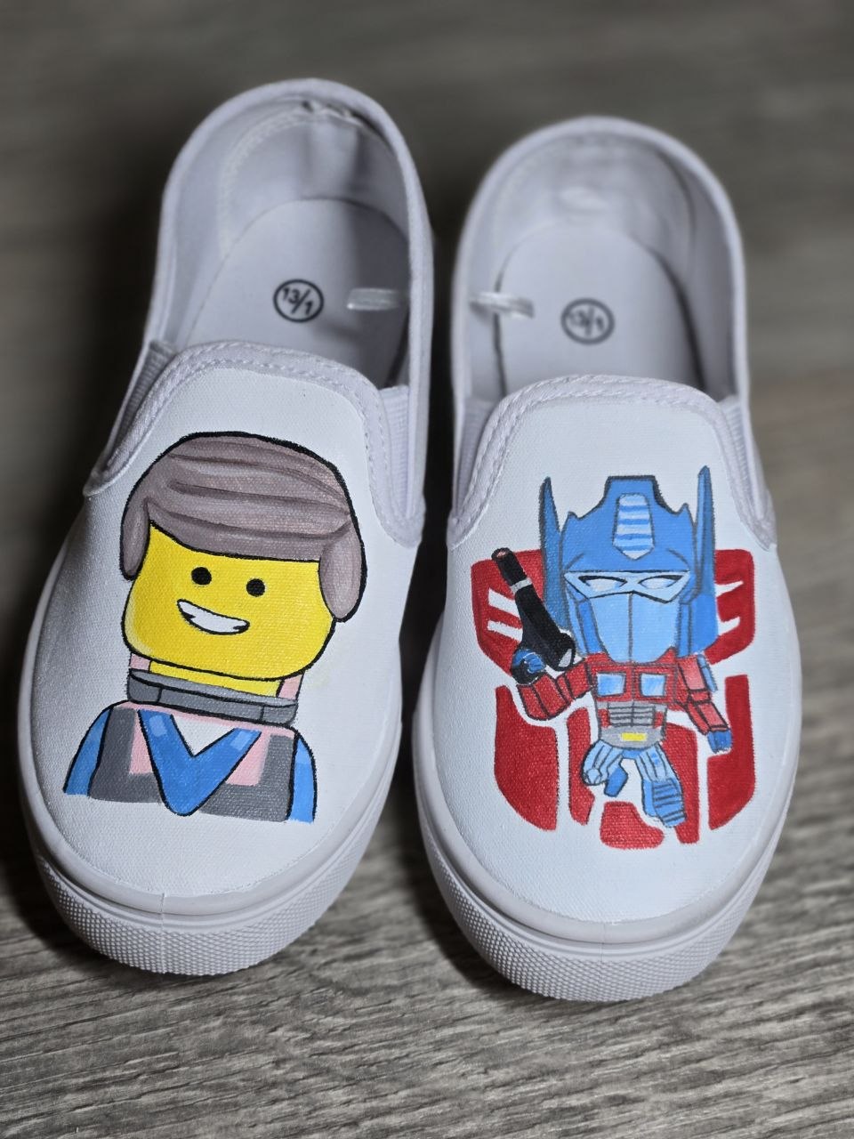 White canvas shoes with colorful hand-painted character designs